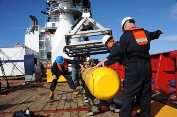 This handout image taken on April 1, 2014 and received on April 10, 2014 from the US Navy shows the Bluefin 21, Artemis autonomous underwater vehicle (AUV) being hoisted back aboard the Australia's Ocean Shield after a successful buoyancy test. - AFP